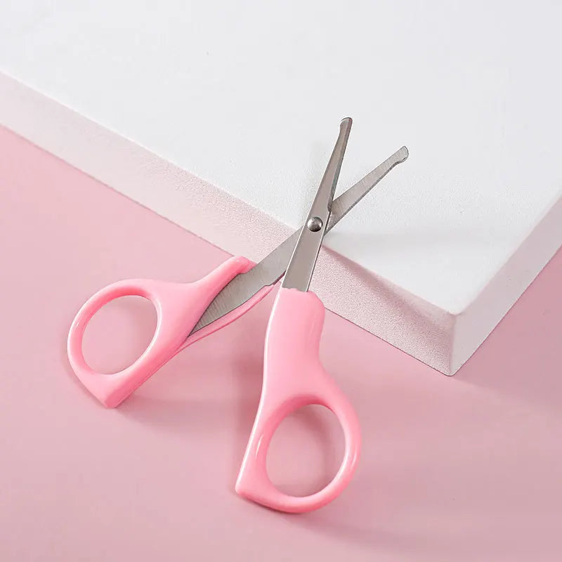 Compact baby nail scissors, essential for gentle care and safe infant grooming.