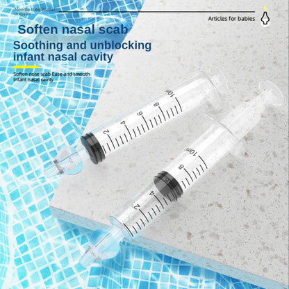 Complete baby nasal aspirator set, including aspirator, saline, and instructions for newborn care.