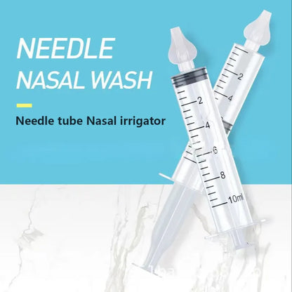 Components of the nasal aspirator kit laid out: aspirator, case, and extra silicone tips for hygiene.