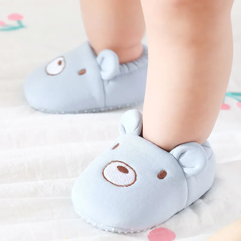 Toddler non-slip floor shoes with black and white cow print, buckle strap, ideal for first steps