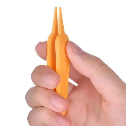 Precision baby nose cleaner tweezer tool, ideal for delicate nasal passages of infants, parenting tool.