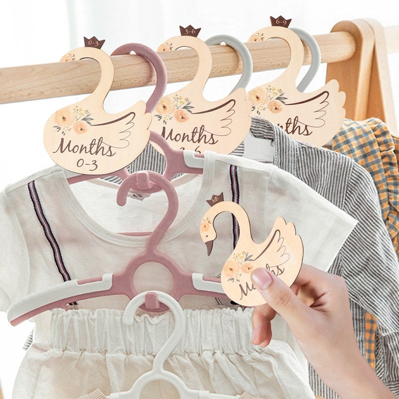 Top-down view of wooden cartoon baby closet dividers, a cute and functional nursery accessory