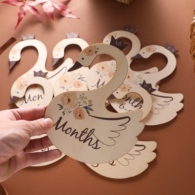 Nursery decor accent: wooden closet dividers featuring charming cartoon swan and whale designs