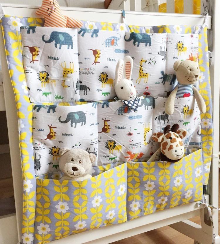 Convenient baby room storage caddy, hooks onto crib, organizes all infant essentials.