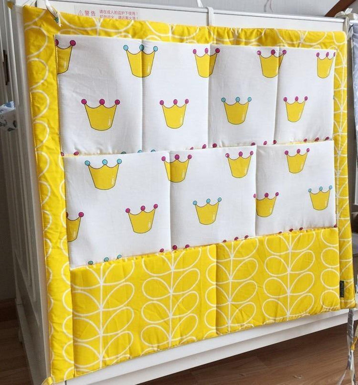 Fabric baby organizer with pockets, a practical and cute addition to nursery decor.