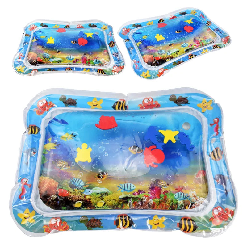 Baby on blue inflatable water mat, colorful sea creatures, tummy time fun developmental toy