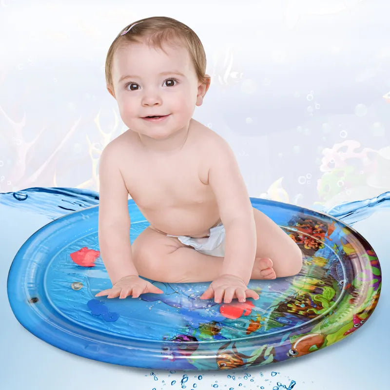 Baby smiling while playing on a durable, leak-proof inflatable water mat, a fun baby learning toy