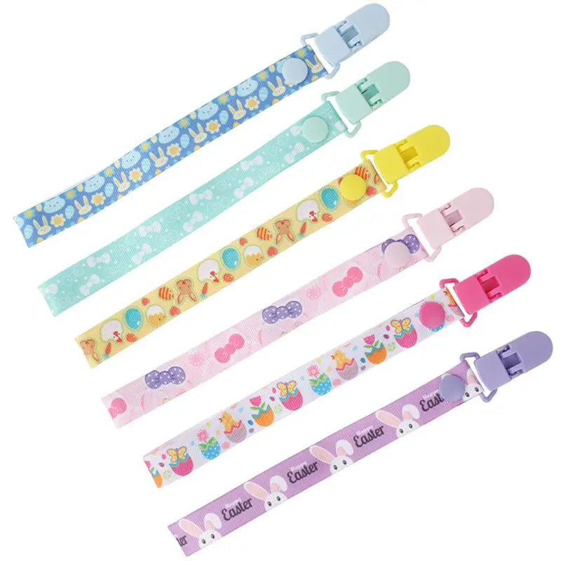Close-up of a blue pacifier clip with a MAM adapter, secure anti-drop dummy clip for toddlers.