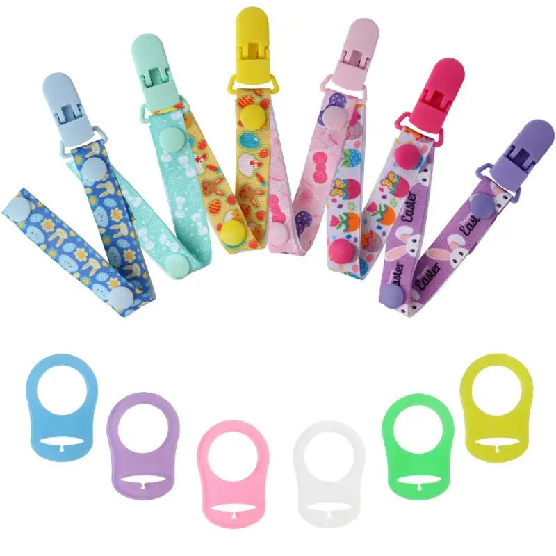 Assorted baby pacifier clip set featuring MAM adapters and various cute patterns, infant care.