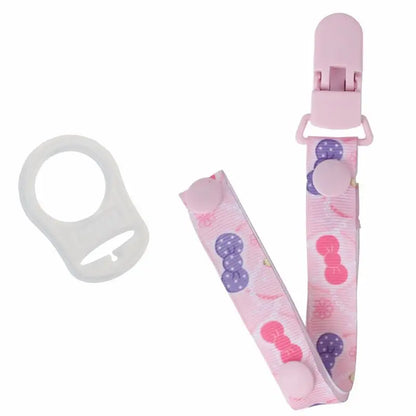 Pink pacifier clip with a durable MAM ring adapter, anti-drop soother holder, baby accessory.