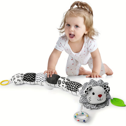 Top-down view of a plush musical rattle toy, designed for easy grasping by little hands.