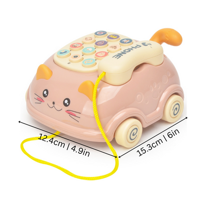 Toddler holding a yellow and blue musical phone toy, engaging with its educational features for early learning.