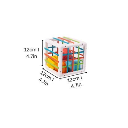 Toddler playing with an educational Shape Discovery Fun Cube, featuring colorful shapes for sorting and learning.