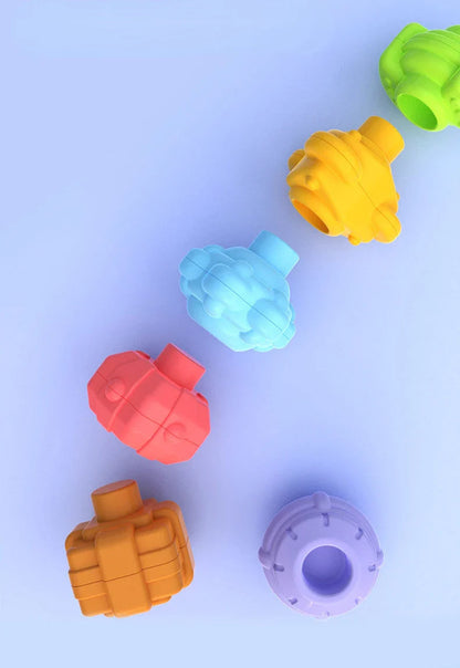 Child fitting shapes into the Baby Rainbow Shape Sorter, hand-eye coordination