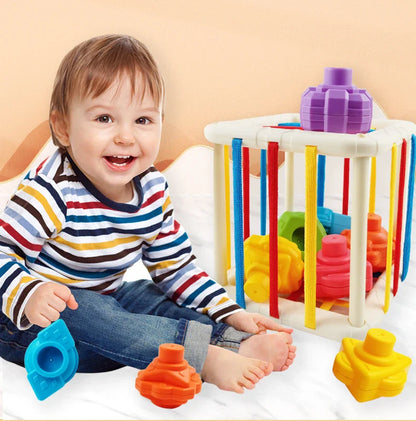 Baby giggling while playing with the Rainbow Shape Sorter, joyful learning