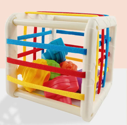 Parents and baby playing together with the Rainbow Shape Sorter, bonding activity