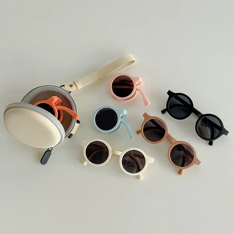 Baby retro foldable round sunglasses in classic black for infants, offering UV protection
