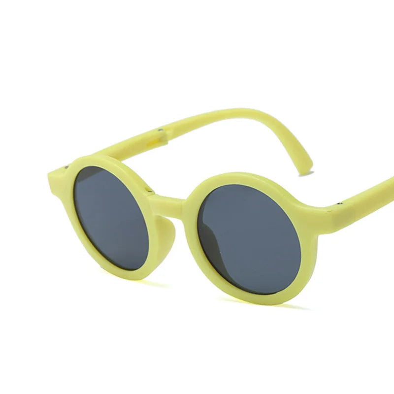 Compact folded retro round baby sunglasses, highlighting portability for baby bags