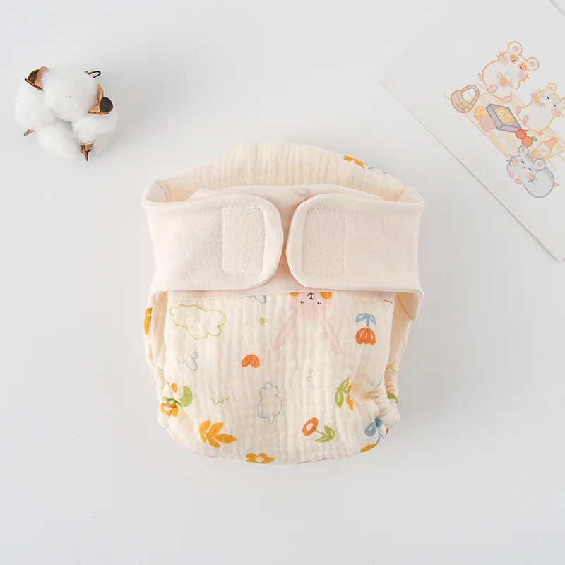 Baby crawling in comfortable reusable training pants, allowing freedom of movement