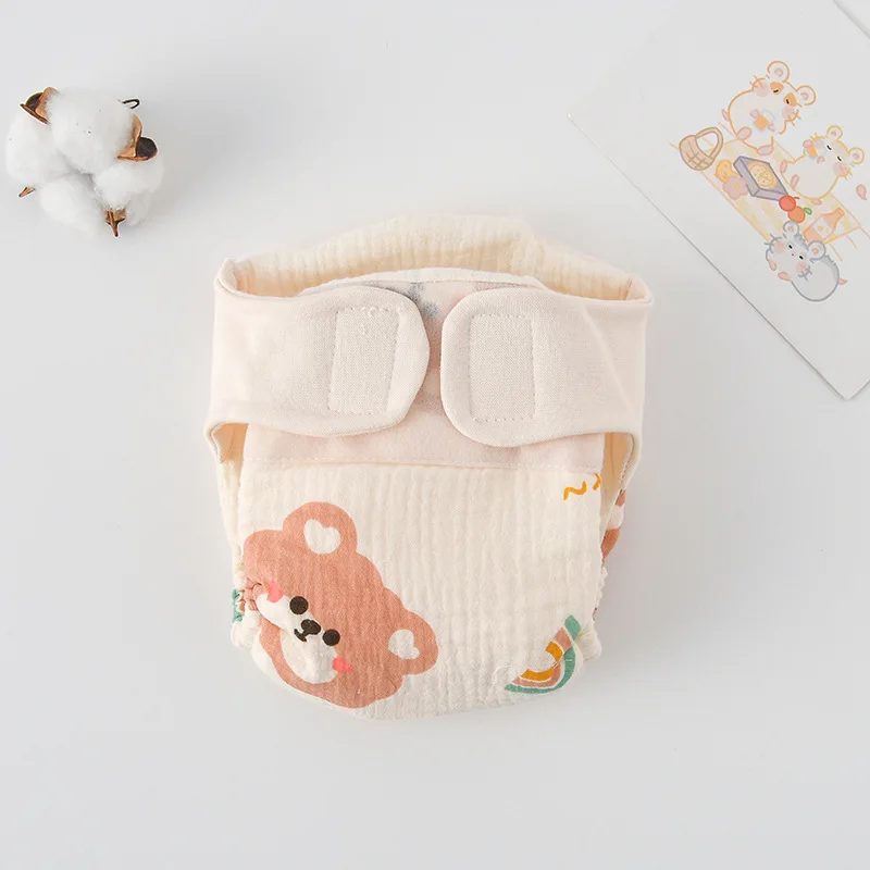 Package of baby reusable training pants, highlighting organic cotton and waterproof features