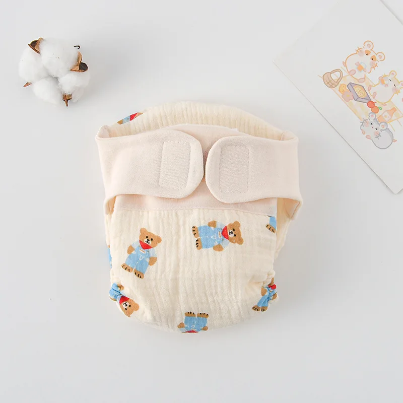 Waterproof reusable training pants, designed to be discreet under baby clothes