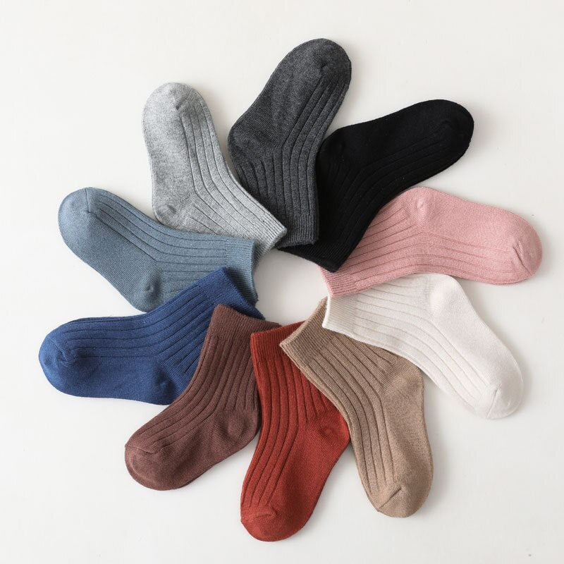 Pair of colorful high neck ribbed baby socks, designed for warmth and snug fit.