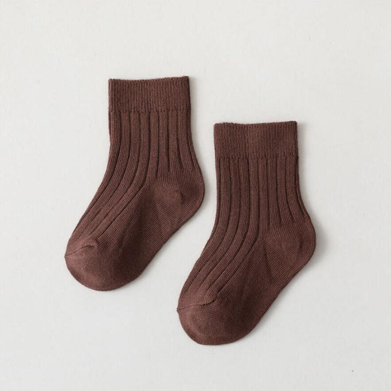 Collection of colorful infant high neck ribbed socks, durable and soft baby clothing.