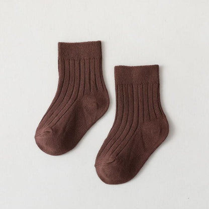 Collection of colorful infant high neck ribbed socks, durable and soft baby clothing.