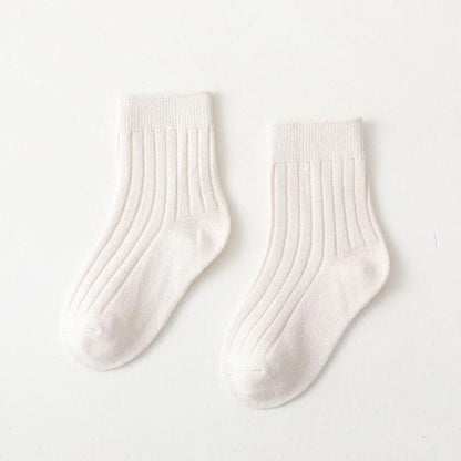 Brightly colored high neck ribbed baby socks, essential cotton accessory for infants.