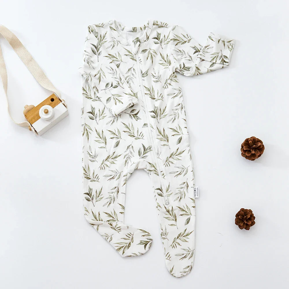 Infant romper, bamboo cotton, folded neatly, showcasing softness and compact design for travel