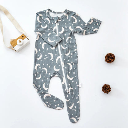 Baby clothing, infant jumpsuit, model wearing, soft bamboo cotton, playing on a blanket, natural light