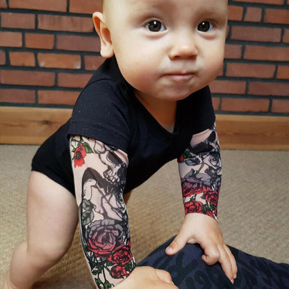 Toddler t-shirt featuring rose print and tattoo sleeves, perfect for matching sibling outfits.