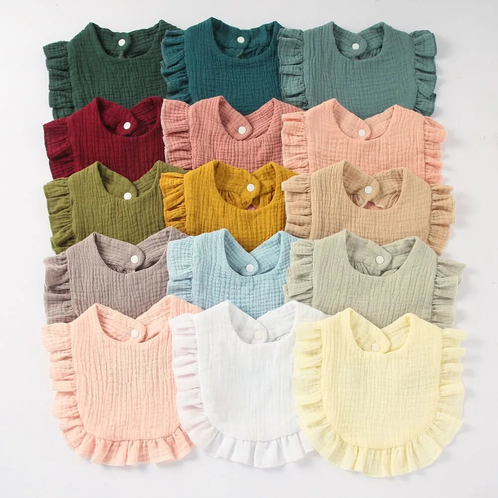 Durable cotton baby bib with ruffle lace trim, feeding friendly