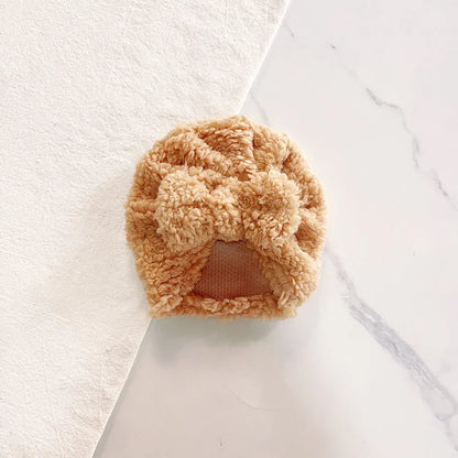 Bundle of assorted color knitted beanie hats for baby, showcasing soft knit and winter appeal.