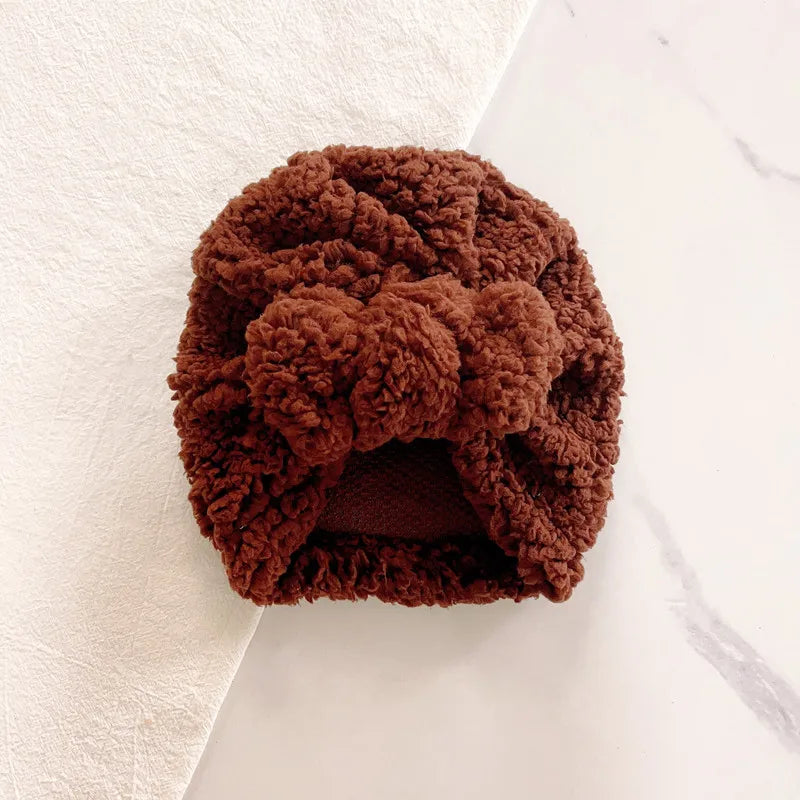 Handmade knitted beanie hat for baby, unique texture, warm and stylish winter accessory.