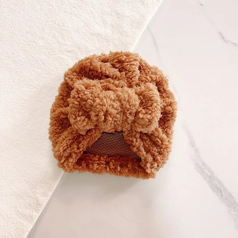 Warm, breathable knitted beanie hat for baby, suitable for varied winter temperatures and comfort.