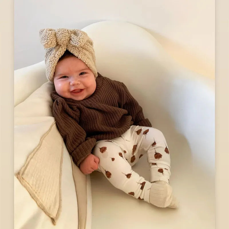 Toddler hat: a grey knitted beanie, ultra-soft knit for winter, comfortable infant headwear.