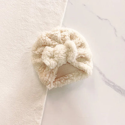 Soft knit baby beanie hat in a vibrant yellow, perfect as a cozy baby accessory for winter.