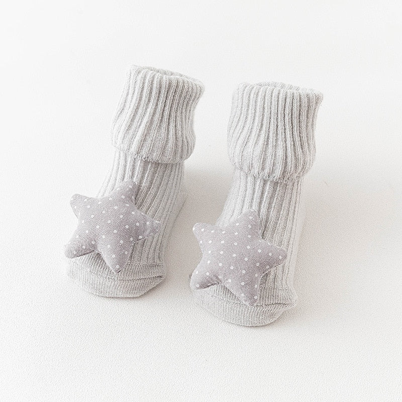 Picture of multi-colored animal anti-slip long socks, warm and secure for baby's feet.