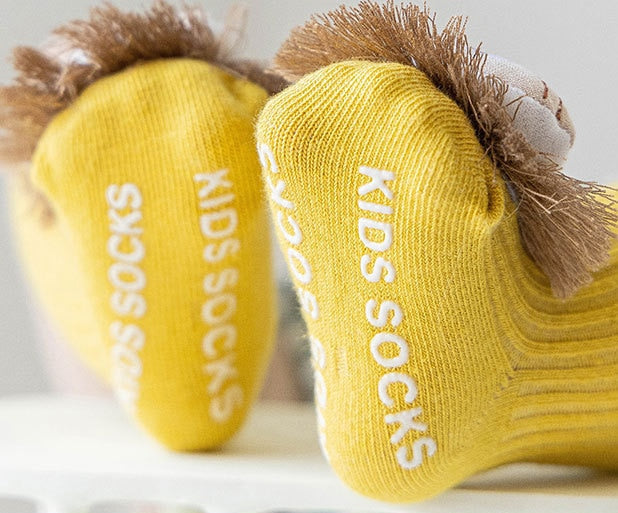 Essential baby clothing: Anti-slip long socks adorned with adorable animals, perfect for everyday wear.