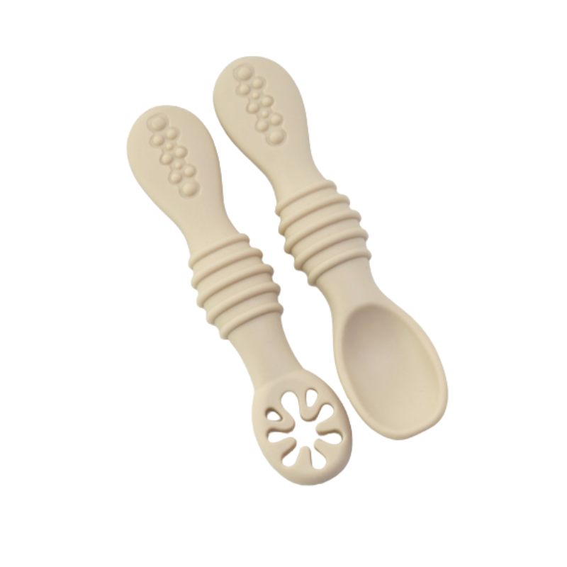 Baby feeding essentials: ergonomic soft silicone spoon for new eaters learning self-feeding techniques.