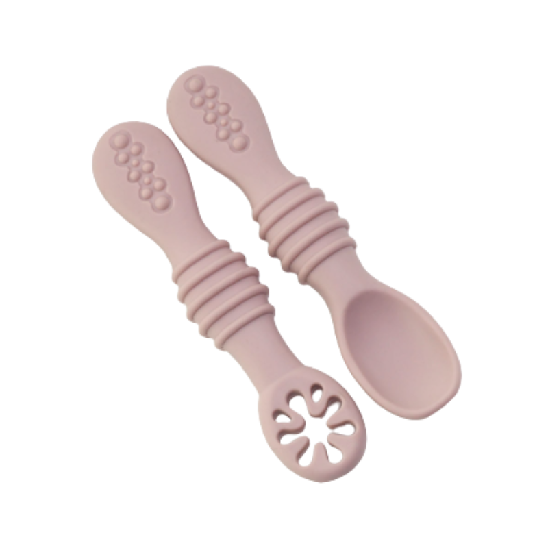 Two gentle silicone baby spoons designed for easy grip, promoting independent self-feeding skills.