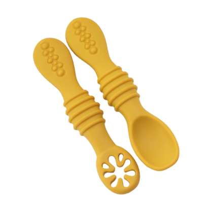 Colorful silicone self-feeding spoons for babies, an essential for learning to eat first solids.