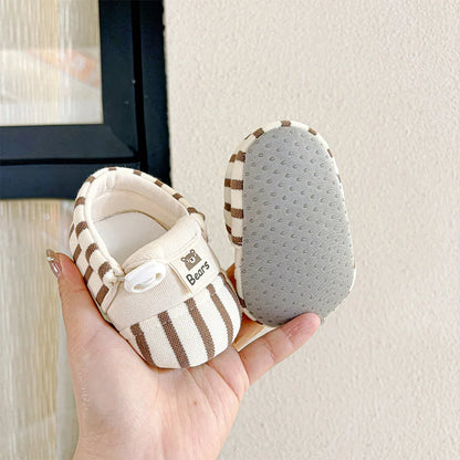 Infant footwear: adorable baby shoes with soft sole and anti-slip grip for toddlers.
