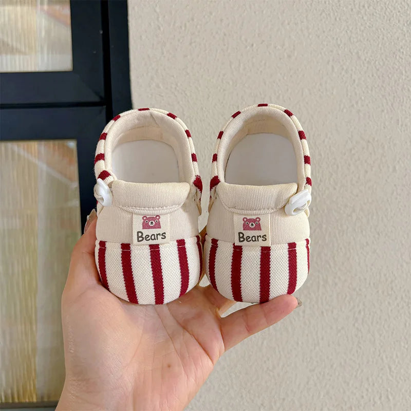 Close-up of cozy baby shoes, featuring a soft cotton sole and anti-slip design.