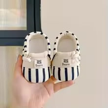 Cotton-soled baby shoes, designed for comfort and anti-slip safety for toddlers.