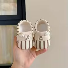 Soft-sole baby footwear, offering anti-slip protection for crawling and first steps.