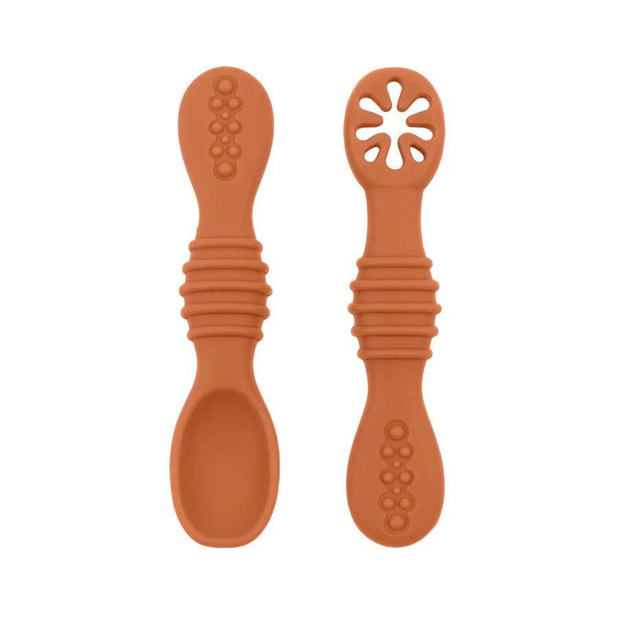 Brightly colored baby silicone spoons, perfect size for little hands, safe BPA-free weaning tool.