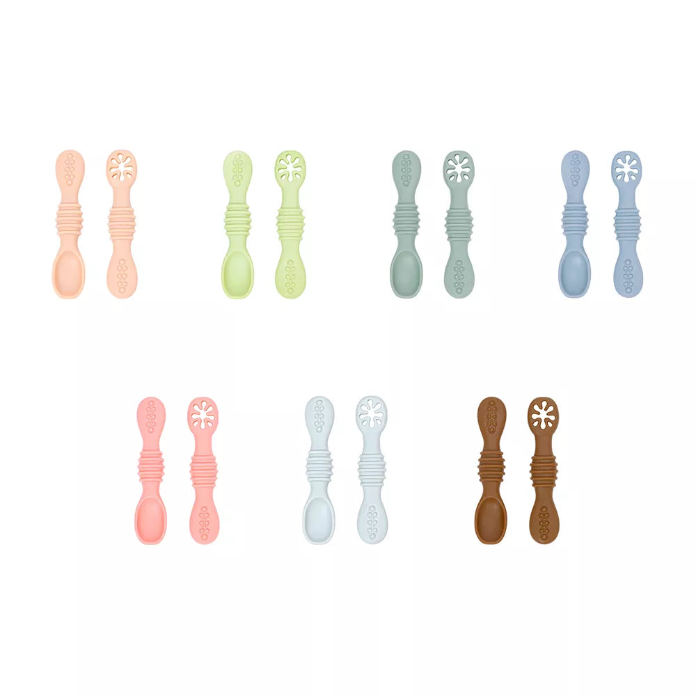Collection of silicone baby spoons for first solid foods, ergonomic and soft for infant feeding.