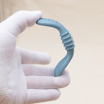 Detailed view of one silicone baby spoon, emphasizing its soft tip and easy-grip design for infants.